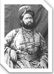 A person in a turban and a beard

Description automatically generated with low confidence