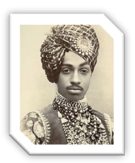 A person wearing a turban and necklace

Description automatically generated with medium confidence