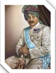 A person in a turban and a blue sash

Description automatically generated with low confidence
