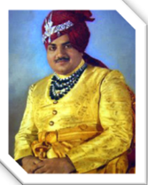 A person in a turban and a red turban

Description automatically generated with medium confidence